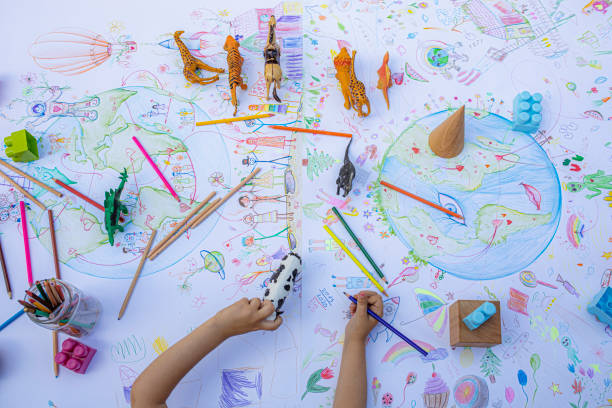 istock Child drawing planet Earth 1251187316
