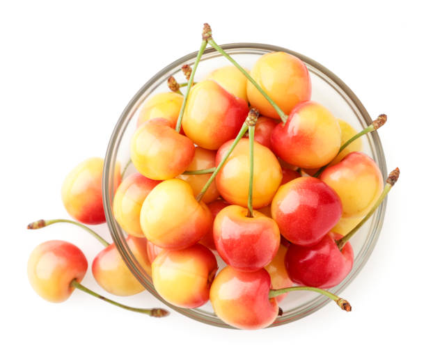 istock Red-yellow cherry in a plate on a white background, isolated. The view from top 1251188736