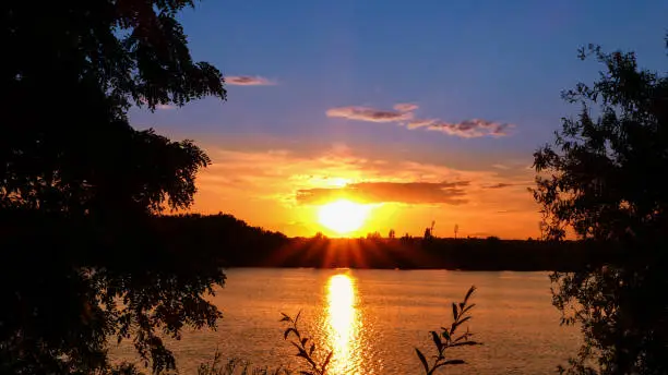 Photo of Amazing sunrise over a lake.