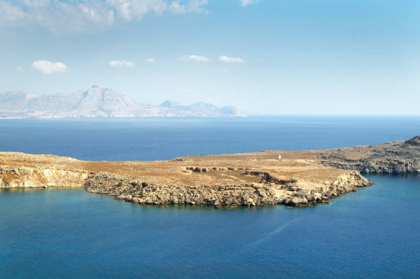 istock Rocky island in the blue sea 1251191192
