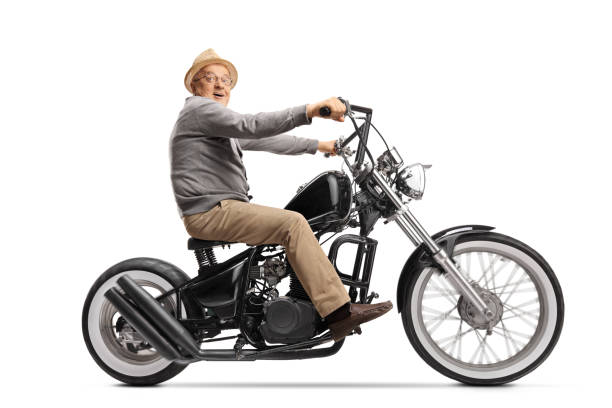 istock Excited elderly man riding a custom chopper motorbile and looking at the camera 1251195020