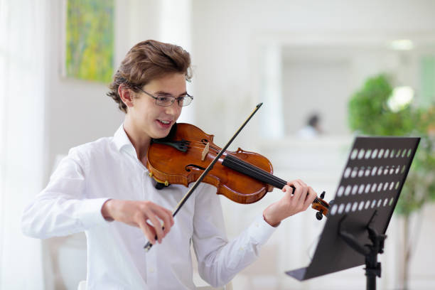 istock Man playing violin. Classical music instrument. 1251196129