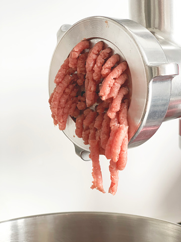 close-up of ground beef in meat grinder