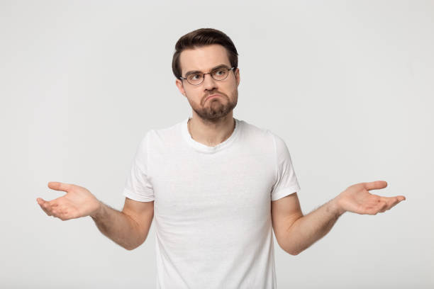 istock Unsure Caucasian man shrug shoulders feel doubtful 1251198912