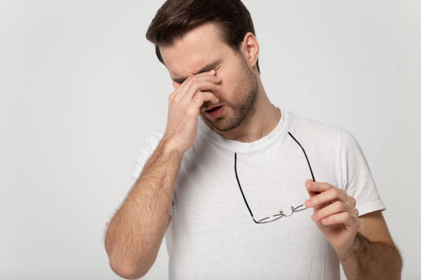istock Unwell Caucasian man take off glasses massaging eyes 1251198914