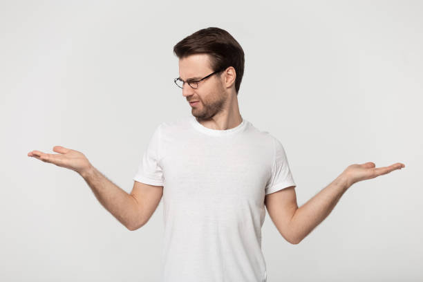istock Doubtful Caucasian man make choice hesitating about two options 1251198929