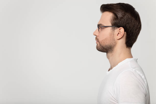 istock Serious Caucasian man in glasses look at blank copy space 1251198944