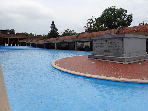 Atlanta, United States - May 22, 2017: The tombs of Martin Luther King Jr and Coretta Scott King are surrounded by a tranquil pool of water at the King Center in Atlanta, Georgia.