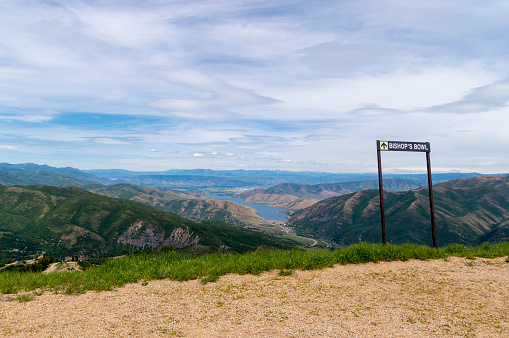 June 20, 2020 - Provo, Utah, USA: This is summer view from the very top of the Sundance Ski Resort, located in Provo Canyon in Utah.  The sign shows one of the ski runs for the resort.  In the distance is Deer Creek Reservoir and Heber Valley, Utah.  The elevation for this shot was about 8500 ft.