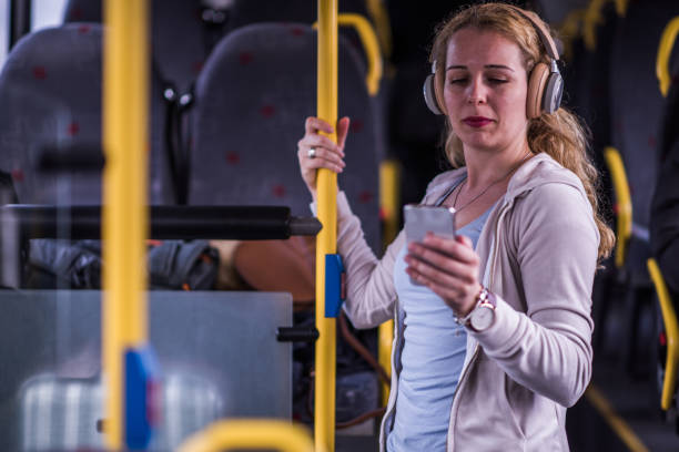 istock Young beautiful woman in bus. 1251201329