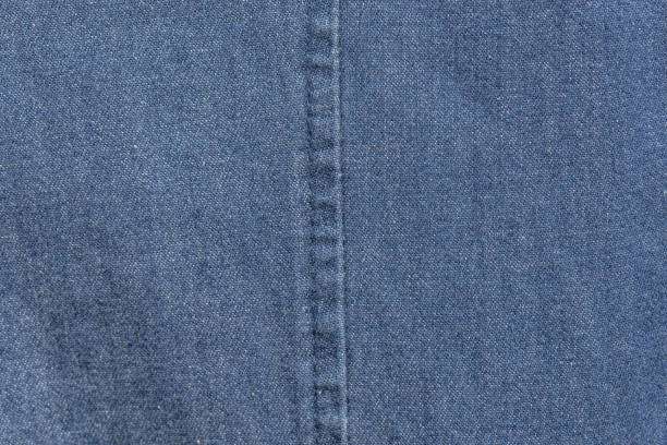 istock Wallpaper - Texture - Blue jeans fabric 1251201956