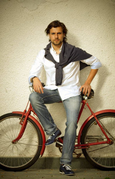 istock Stylish young man riding his retro cycle. 1251204130