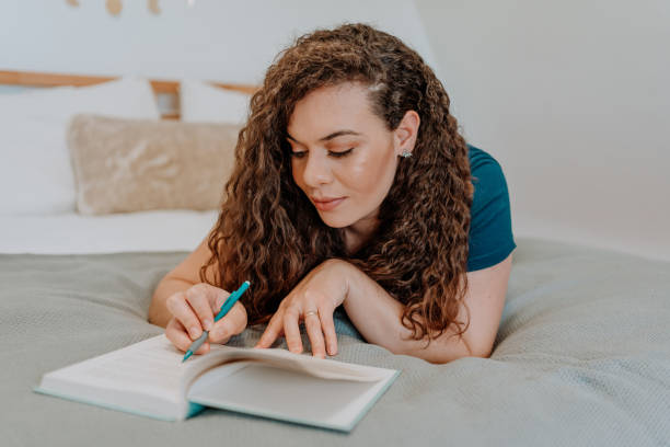 istock Mixed race latin woman reading a book 1251205955
