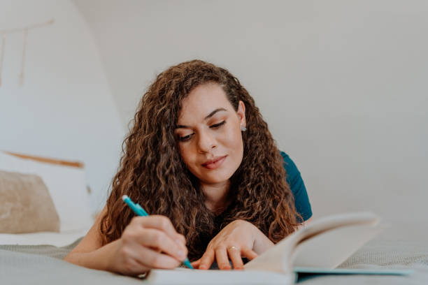 istock Mixed race latin woman reading a book 1251206147