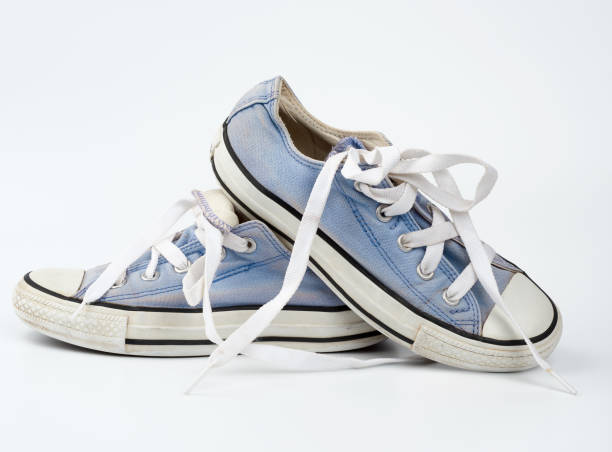 istock pair of light blue worn textile sneakers with laces 1251207944