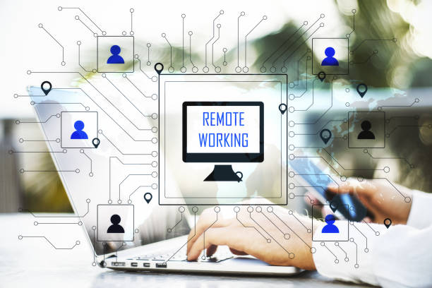 istock Hand with phone using laptop on coworking workplace 1251208048