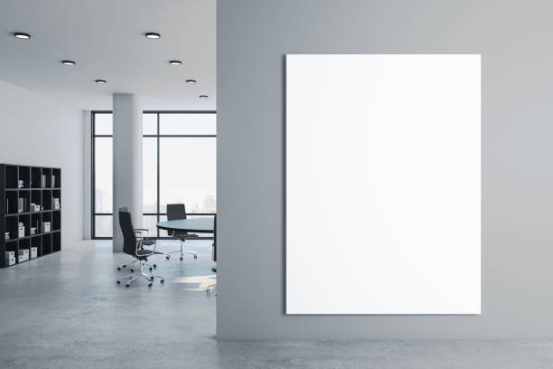 istock Clean meeting room with blank billboard on wall. 1251208162