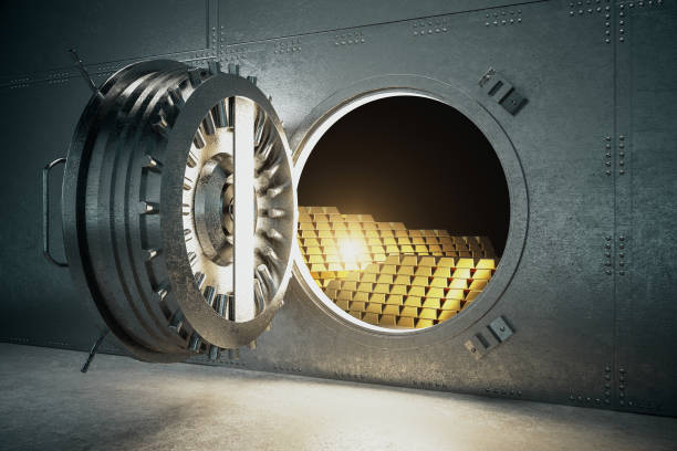 istock Open metal safe with gold bars. 1251208845