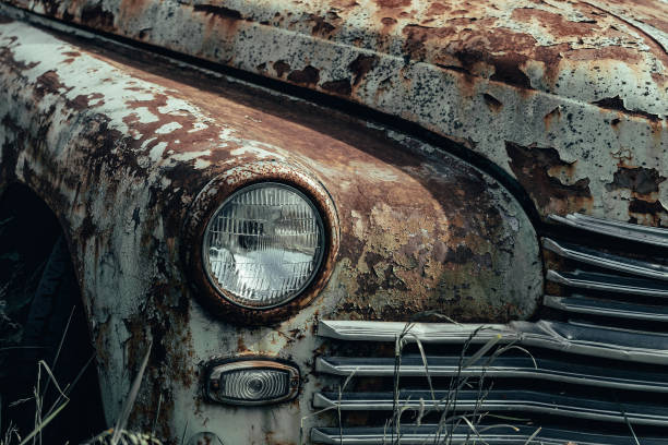 istock Old rusty grunge retro vintage car with peeling paint close up, abandoned auto 1251209514