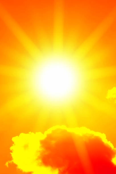 istock Bright sun with beautiful beams in the sky with clouds (toned in red) 1251209750