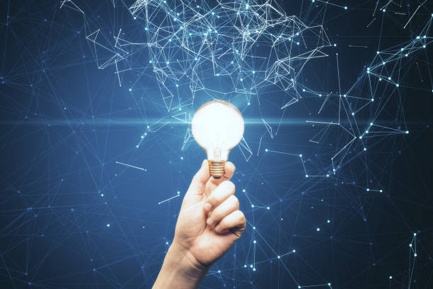 istock Businessman hand holding glowing lamp 1251209789