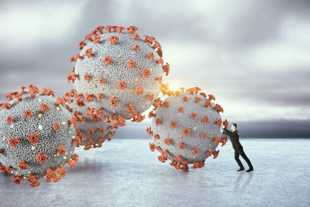 istock Businessman holds back coronovirus pandemic 1251209813