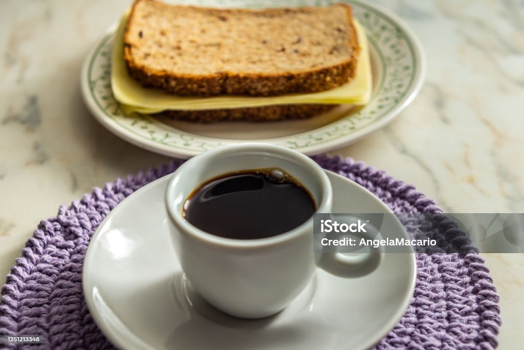 Coffee. Cup of coffee with a mozzarella sandwich. Black Color Stock Photo