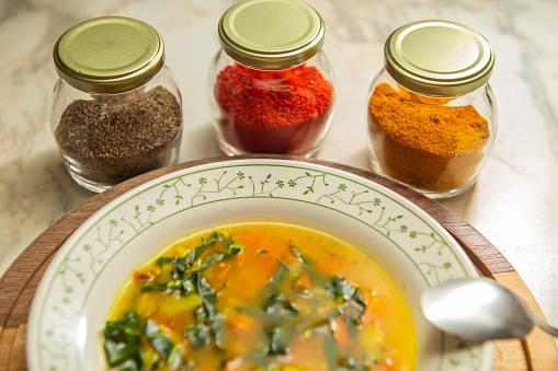 Vegetable soup plate. Seasonings inside glasses.