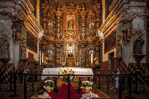 Tucson, Arizona, USA - May 3, 2019: Interior of the San Xavier Mission in Tucson. The mission is the oldest remaining European structure in Arizona. The Franciscan Catholic Mission was completed in 1791 and remains open for worship and services today.