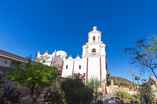 Tucson, Arizona, USA - May 3, 2019: Exterior of the San Xavier Mission in Tucson. The mission is the oldest remaining European structure in Arizona. The Franciscan Catholic Mission was completed in 1791 and remains open for worship and services today.