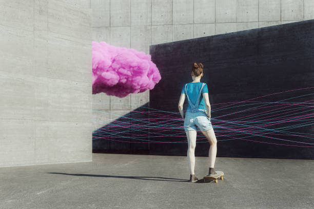 istock Young woman with skateboard and pink cloud 1251217650