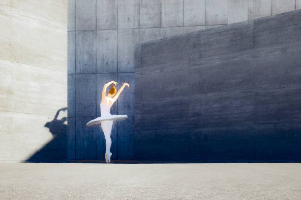 istock Empty modern concrete environment with dancing ballerina 1251218232