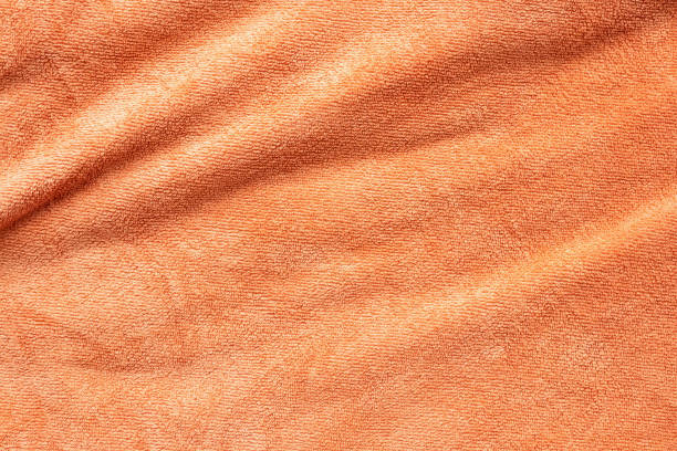 istock Orange towel fabric texture surface close up background 1251219018