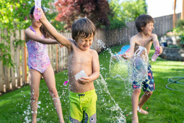 istock Mixed Race Siblings Playing Outside On A Warm Summer Day 1251219158