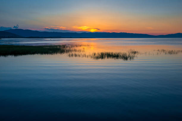 istock Beautiful sunrise in the early morning on Lake Sevan, Armenia 1251219345
