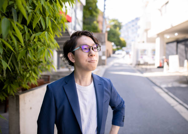 istock Young business man standing on street 1251219364