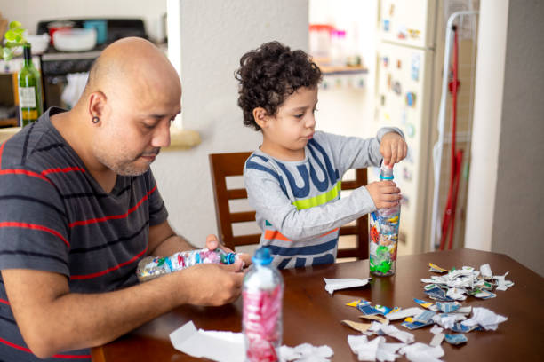 istock Father and son recycling, ecoladrillos 1251223212
