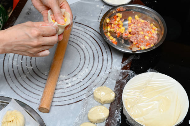 istock lady making traditional Chinese buns at home 1251226300