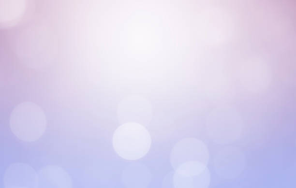 istock White bokeh defocus glitter blur on purple background. bokeh abstract background. 1251229580