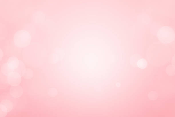 istock White bokeh defocus glitter blur on a pink background. bokeh abstract background. 1251229588