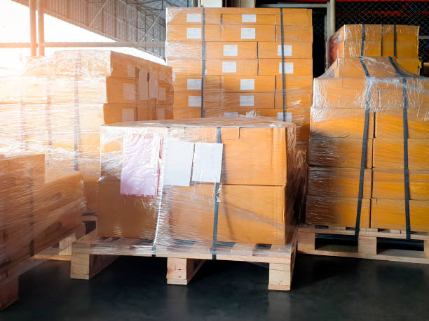 istock Stack of shipment boxes on pallet at the warehouse. 1251229613