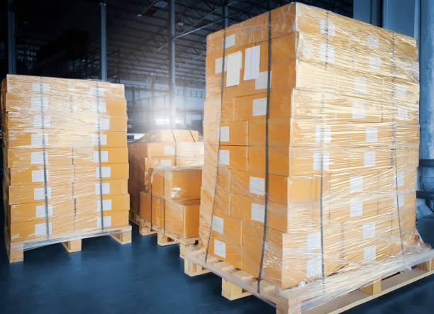 istock Stack of shipment boxes on pallet at the warehouse. 1251229617