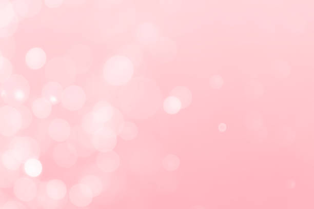 istock White bokeh defocus glitter blur on a pink background. bokeh abstract background. 1251229691