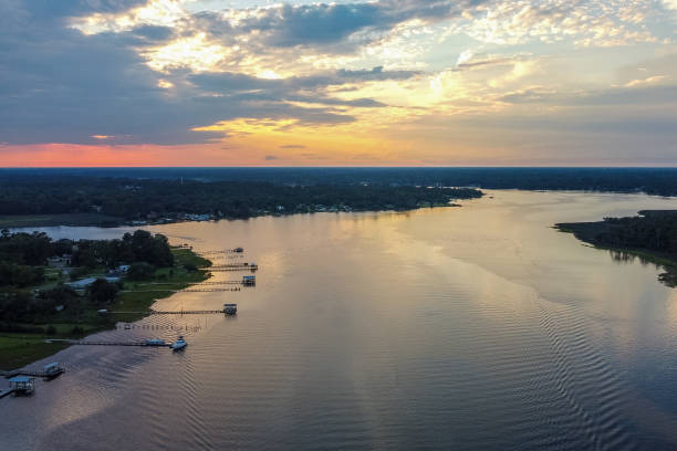 istock Westward Drone Perspective over Florida River at Sunset 1251230219