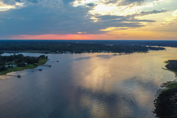 istock Drone Perspective over Coastal Florida River at Sunset 1251230303