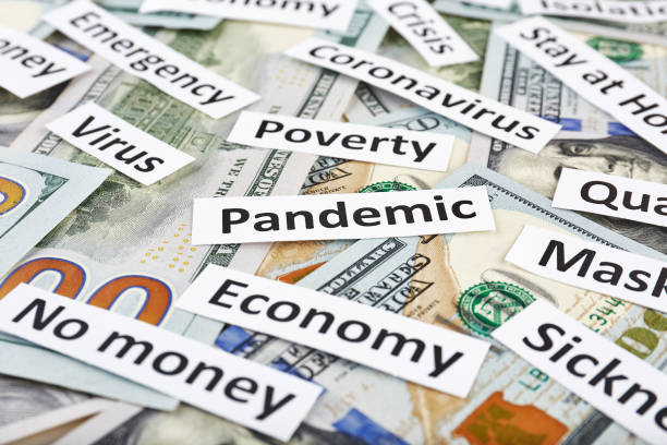 istock Coronavirus, COVID-19 headline clippings on 100 USD banknotes 1251231281
