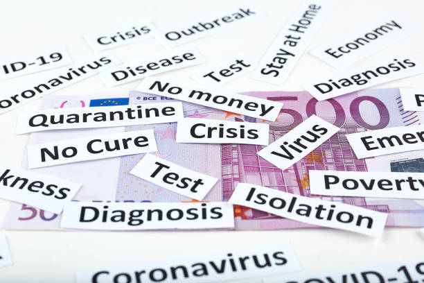 istock Coronavirus, COVID-19 headline clippings on 500 Euro banknote 1251231807