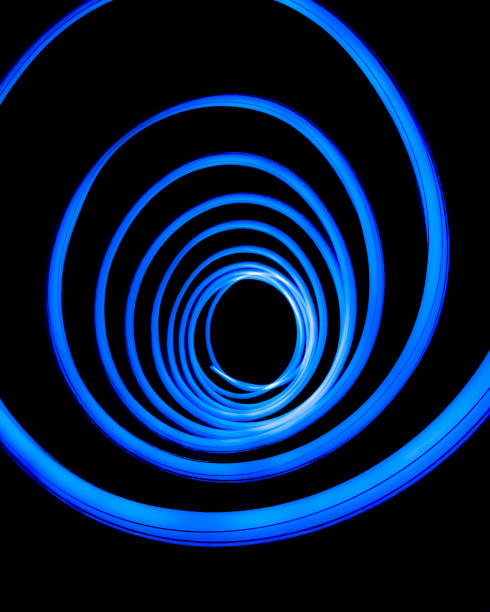 istock Light swirls on a black background, abstract & glowing 1251232004