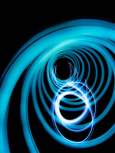 istock Light swirls on a black background, abstract & glowing 1251232005