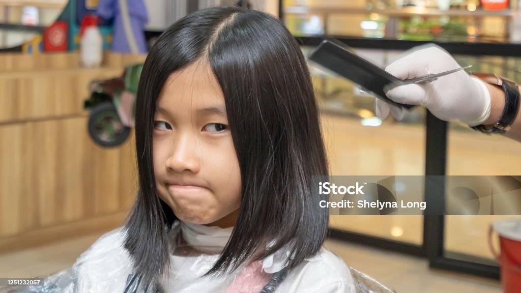 Little Girl Worries While Doing Hair Cutting At The Hair Salon During The  New Normal Stock Photo - Download Image Now - iStock